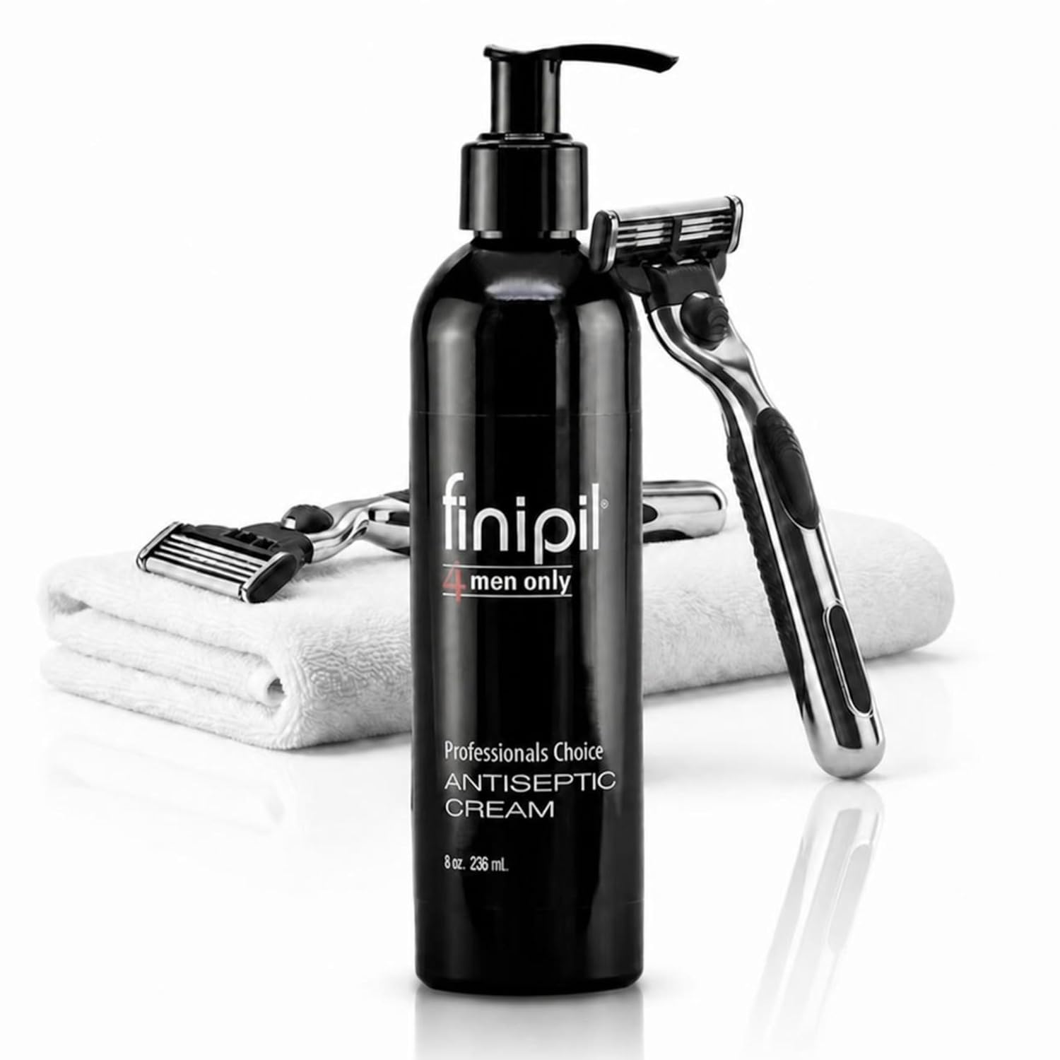 Finipil Men Only Professionals Choice antiseptic cream in a black 8 oz (236 ml) pump bottle next to a razor and a folded white towel