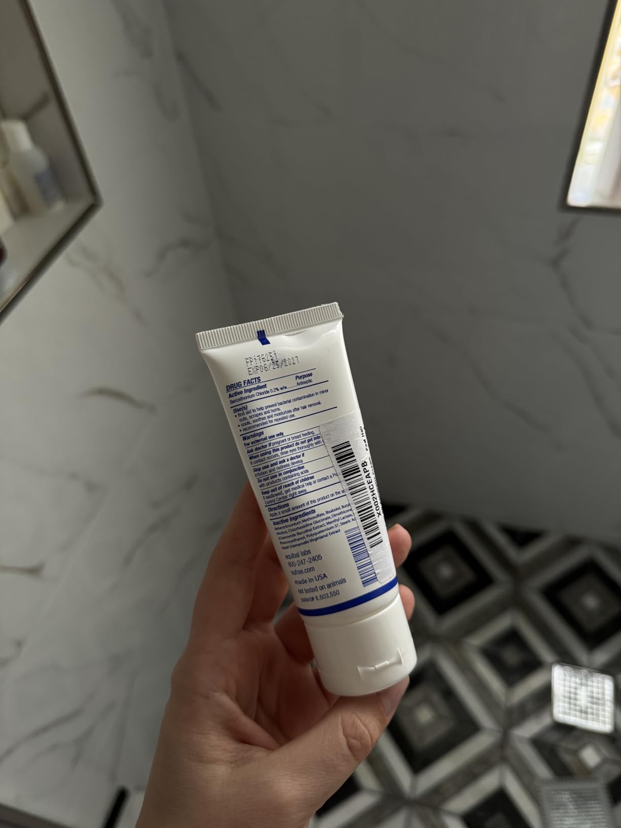The back of a Finipil Lait 50 tube showing the Drug Facts label